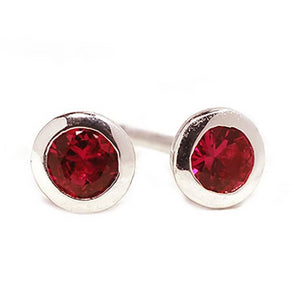 18 Karat White Gold Ruby Bezel Set Stud Earrings - OGI-LTD